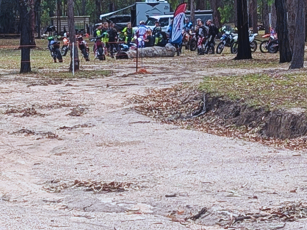Cyclist navigating a mountain biking trail in Childers, Queensland, with scenic countryside views.